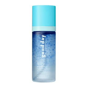 A bottle of Good Day Crystal Clear Refreshing Mineral Micra Mist, featuring a light blue cap and a blue-to-clear gradient bottle, centered on a solid green background.