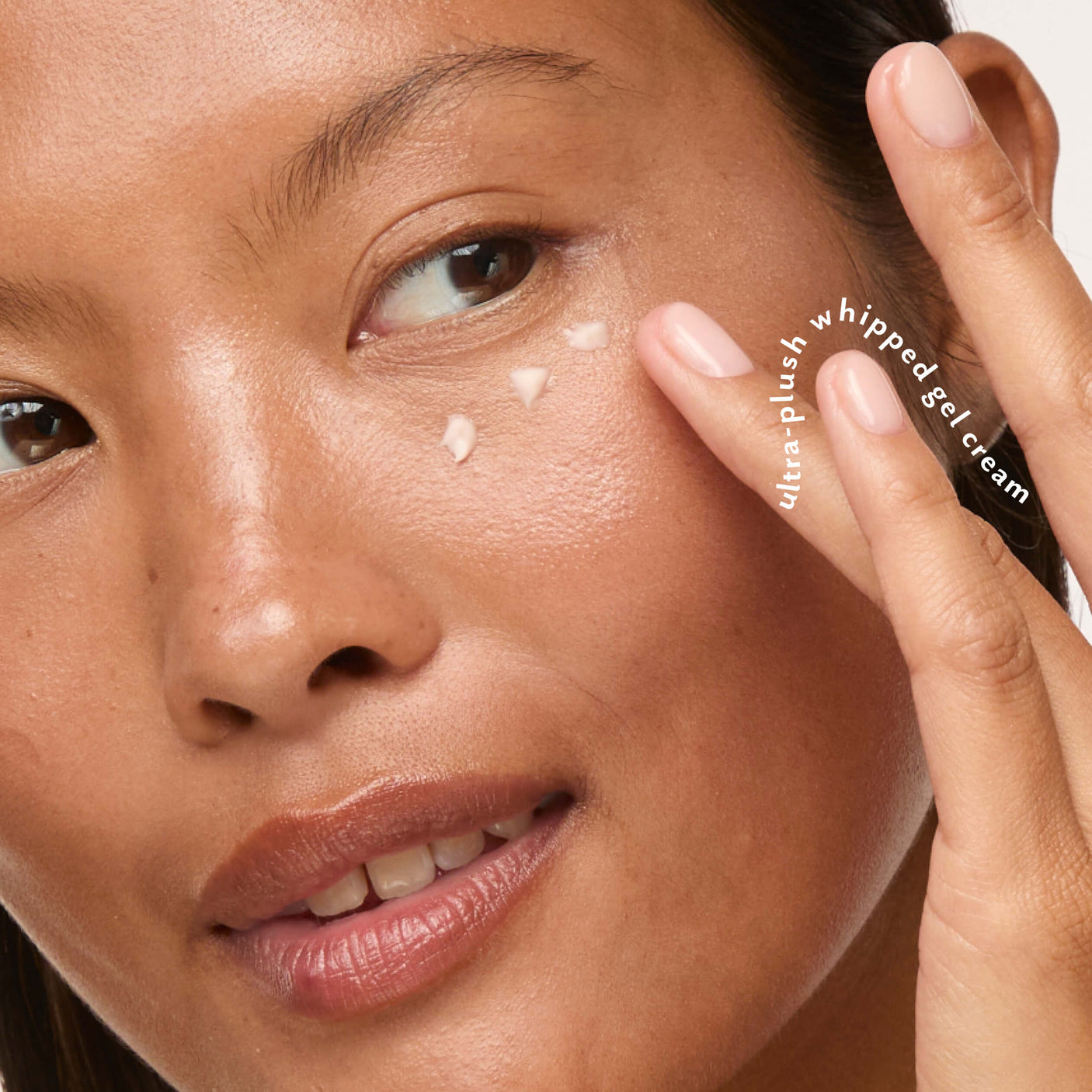 Woman gently applying Eye Pillow 360° Brightening Eye Cream beneath her eye.