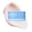Blue jar of Eye Pillow 360° Brightening Eye Cream displayed over a pale peach cream swatch.