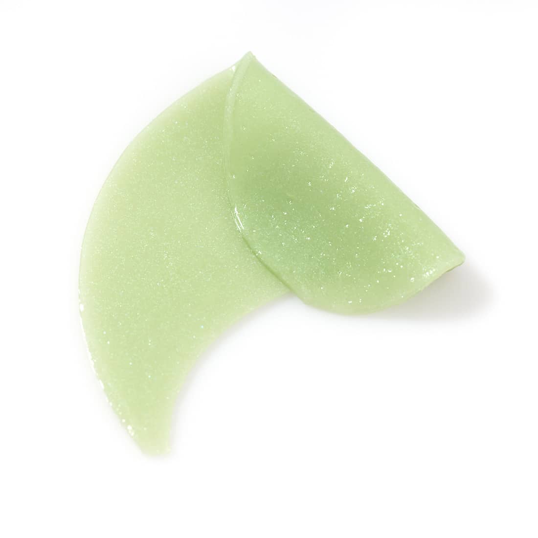 Green hydrogel under-eye patches with glossy gel texture for depuffing and soothing skincare treatment
